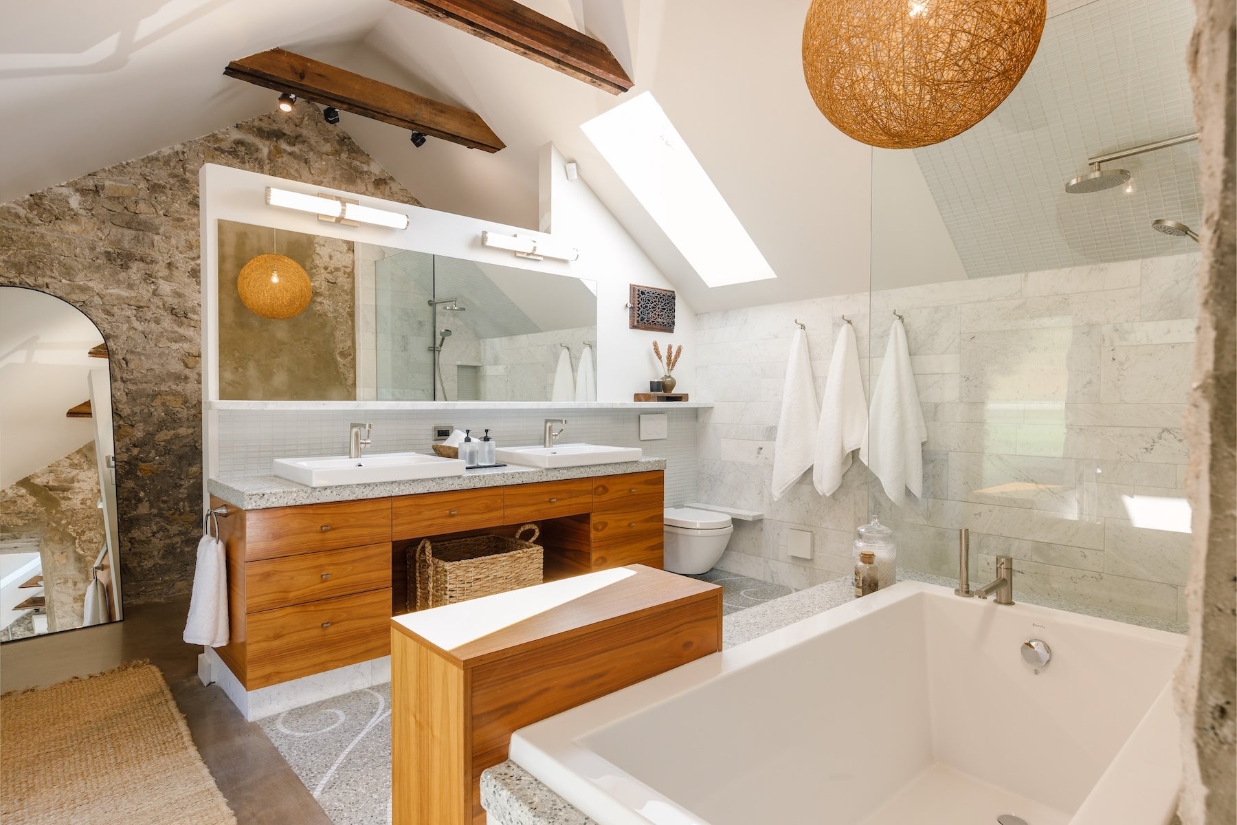 Spa-like bathroom with marble finishes and upscale toiletries